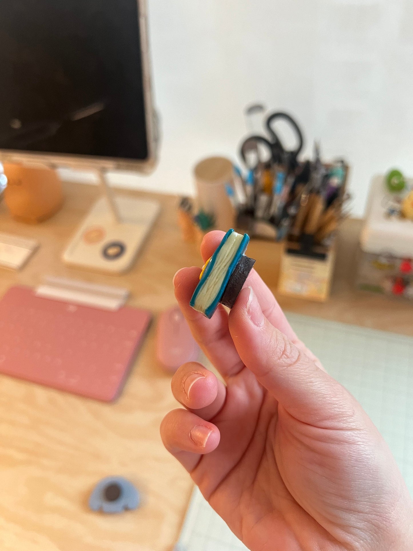 miniature book or sweater fridge magnets