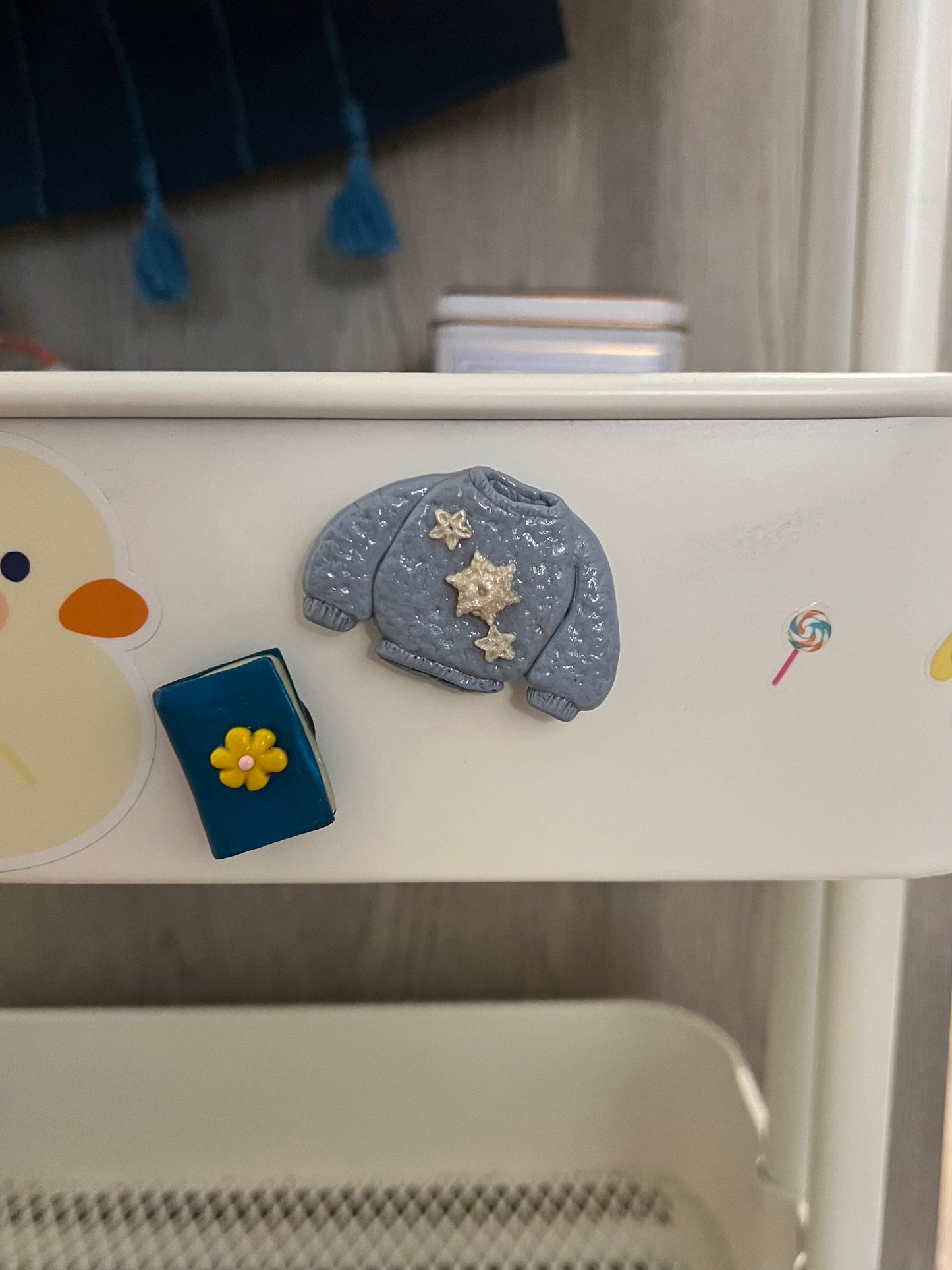 miniature book or sweater fridge magnets