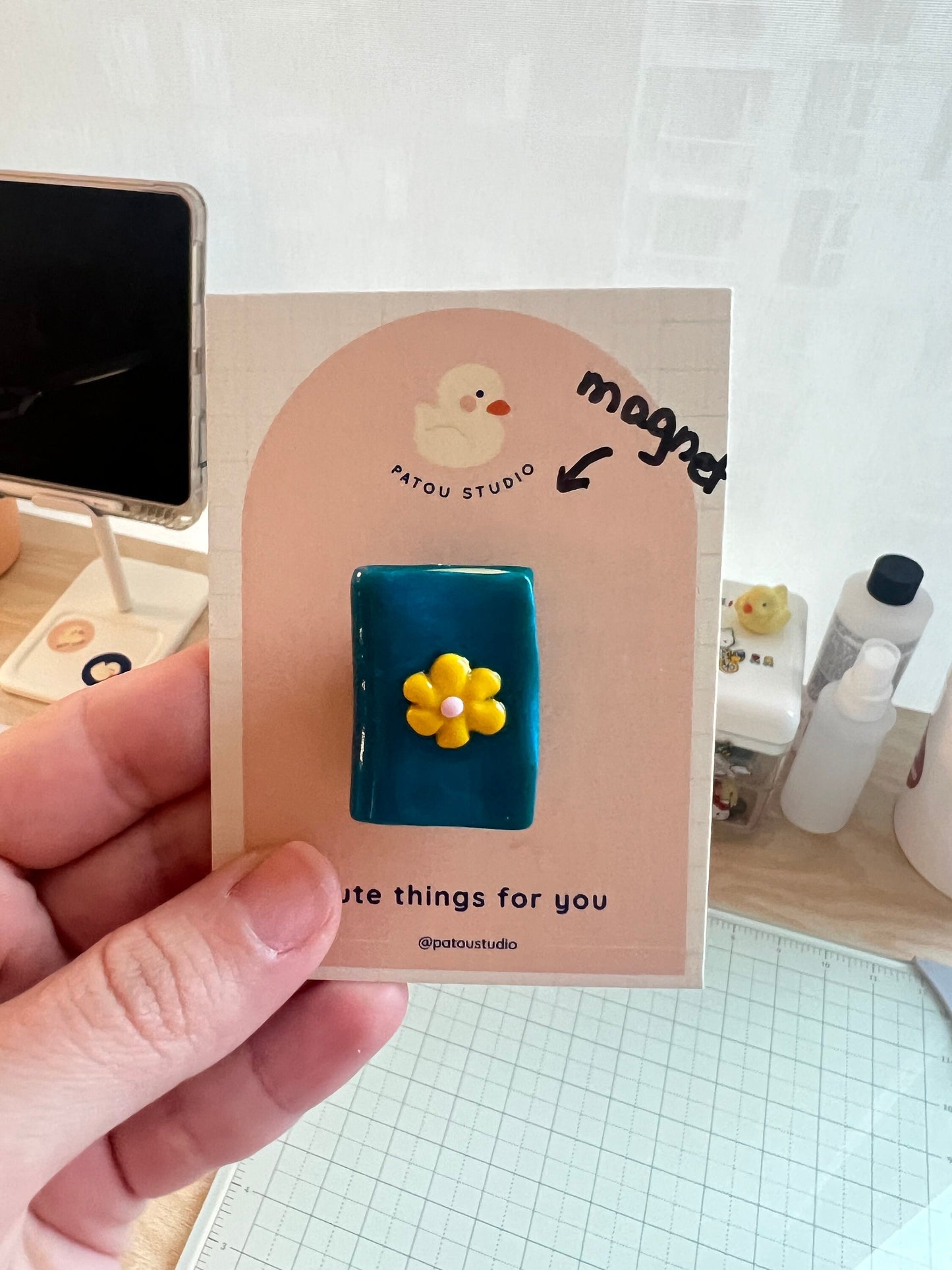 miniature book or sweater fridge magnets