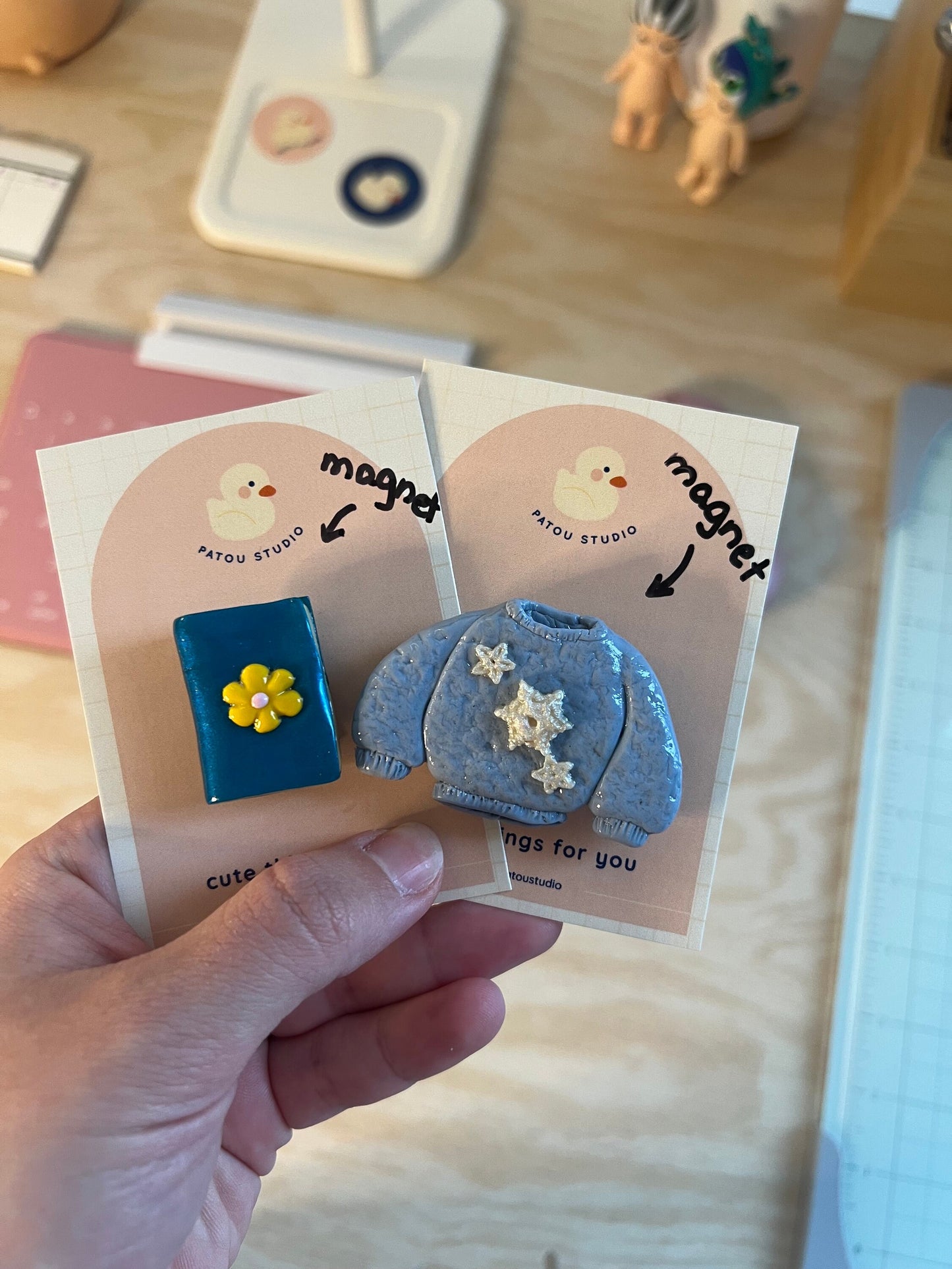 miniature book or sweater fridge magnets